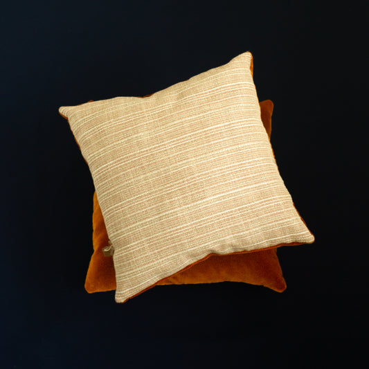 Beige and orange decorative pillows The Niche Society