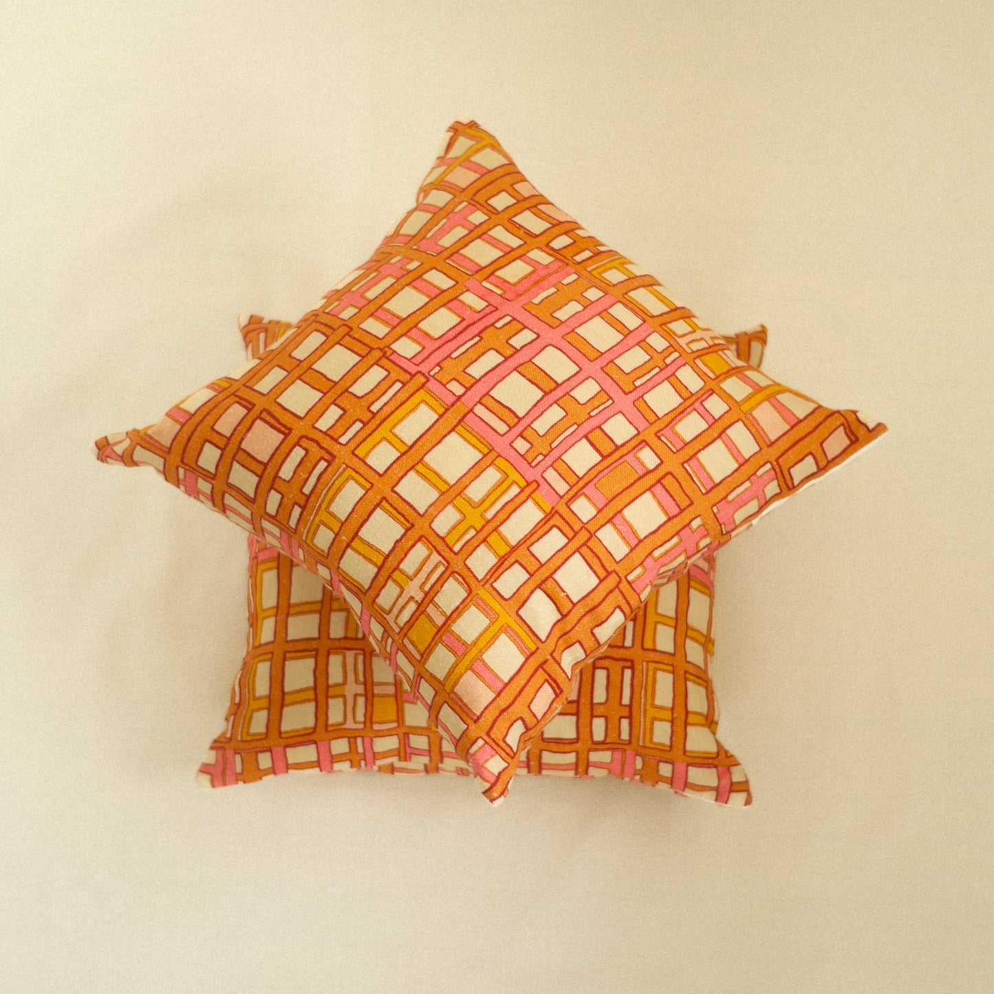 Decorative pillow with a geometric orange pattern art deco
