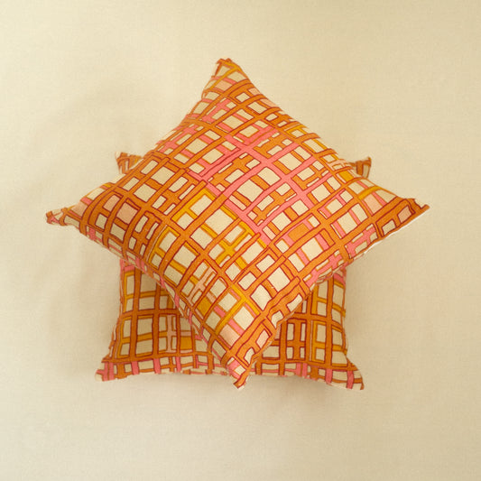 Decorative pillow with a geometric orange pattern art deco
