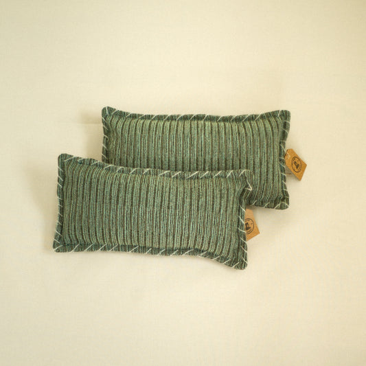 Two green velvet textured decorative pillows